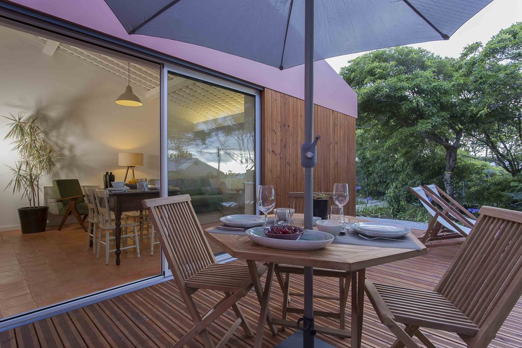 House accommodations/lodging at Quinta dos Peixes Falantes: place settings on deck seating with view to the interior spaces